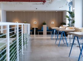 white-and-blue tables facing white balustrade